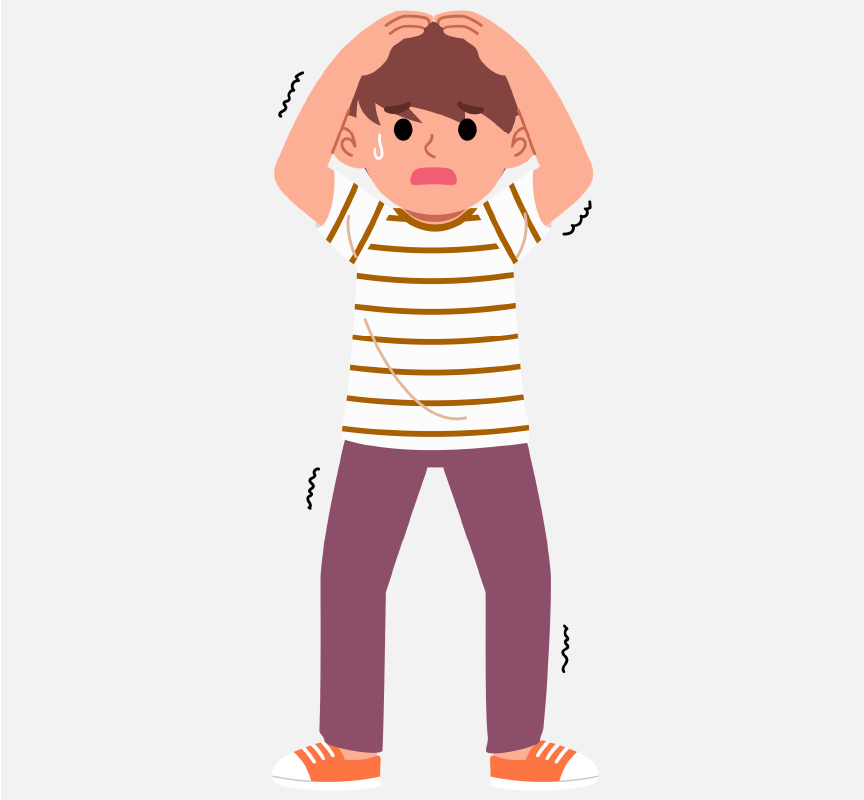 A boy whose body is shaking. He has his hands above his head, and he's crying.