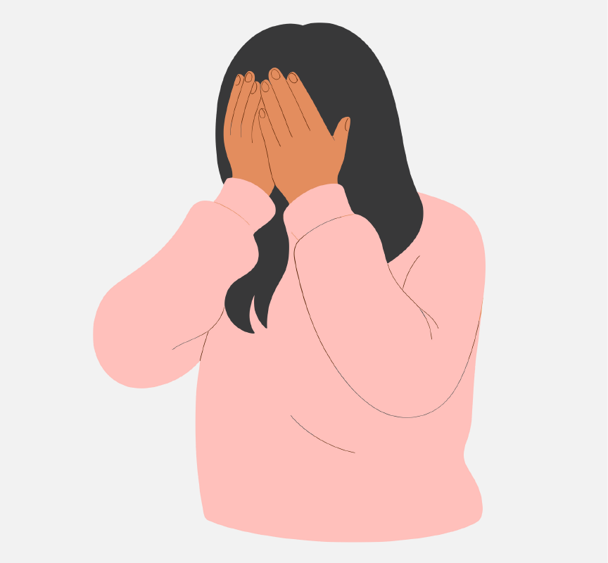 A woman covering her face with her hands.