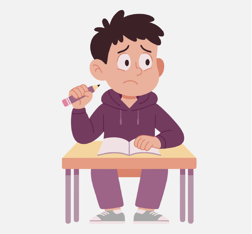 A boy sitting at a school desk is looking away from his school work.