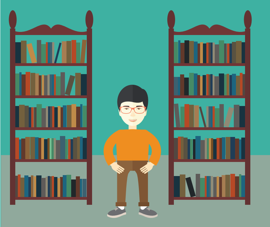 A smiling boy stands between two bookshelves.