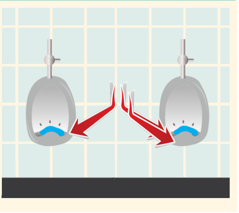 Two urinals shown with blue discs that help them smell better. Red arrows point out the discs at the bottom of the urinals.