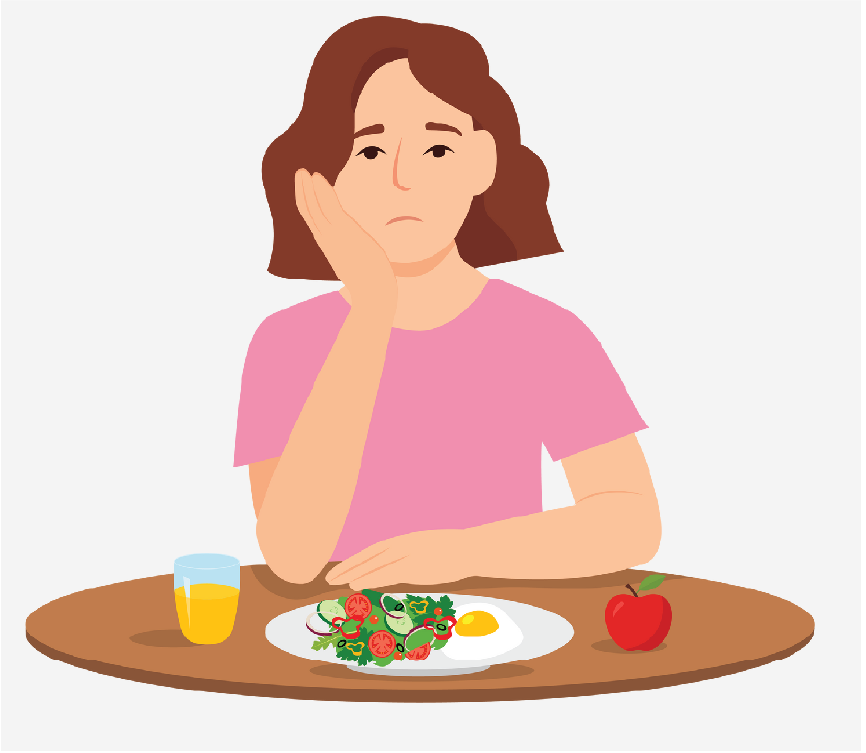 A sad woman sitting in front of a plate of food, an apple, and a drink.