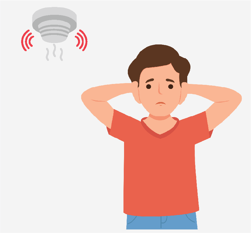 A boy covering his ears as a smoke detector makes noise.