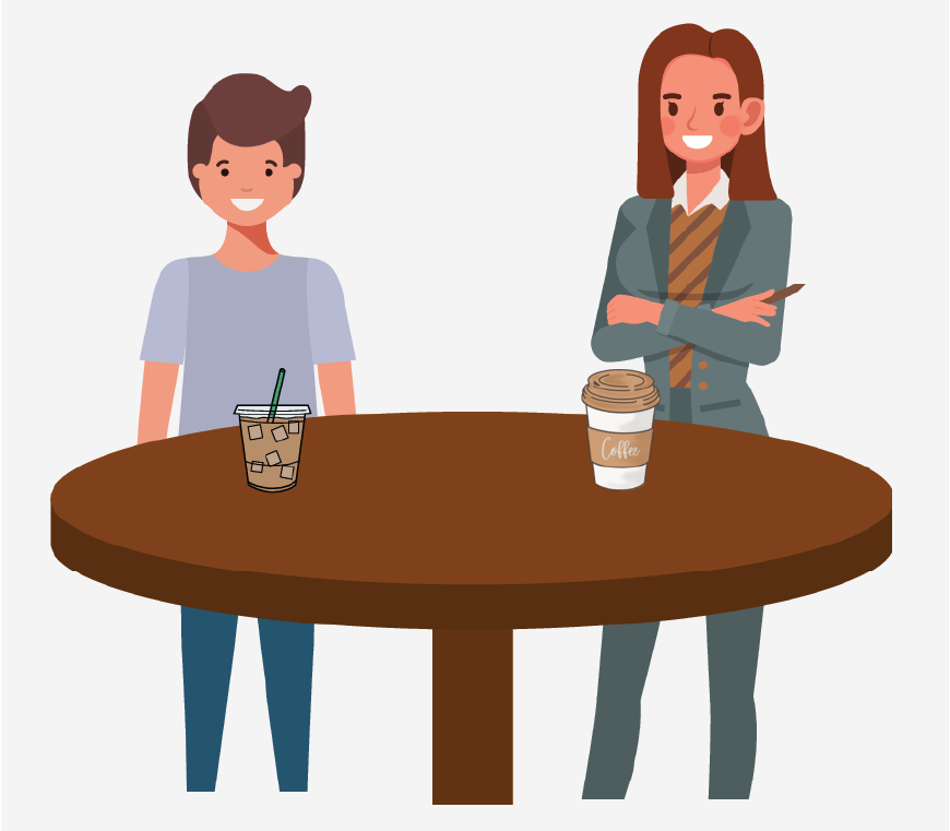 A boy and a social worker standing by a table. There are two drinks on the table.