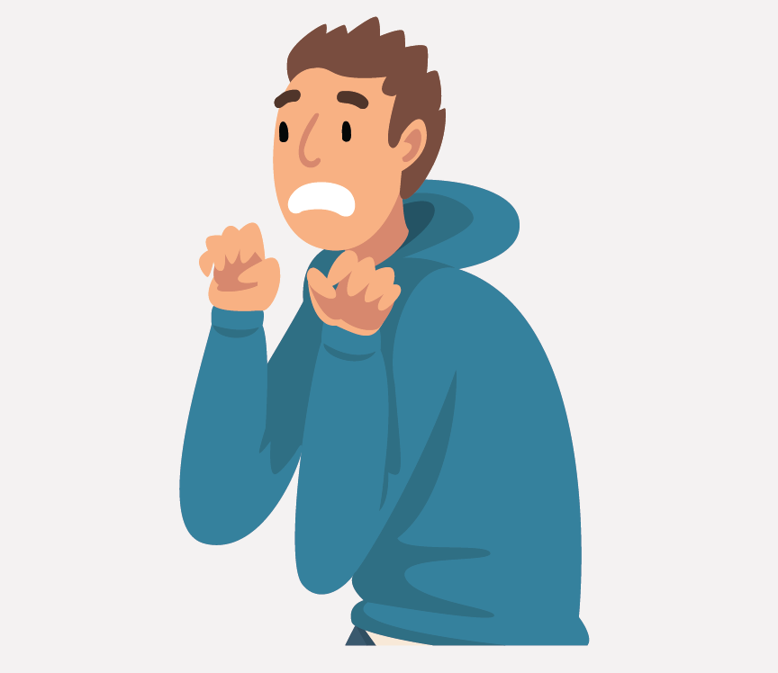 A boy squeezing his hands into fists in fear.