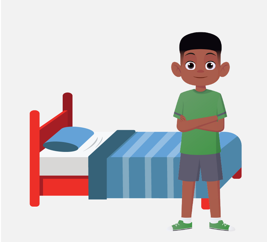 Un niño pequeño de pie junto a su cama de color azul y rojo.
