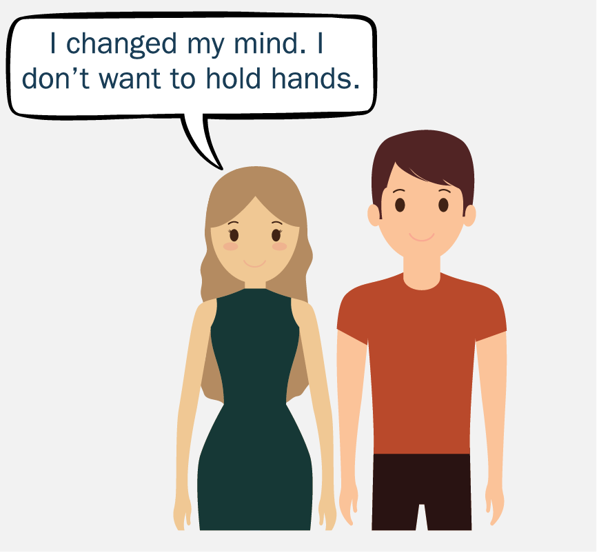 Two people standing next to each other. The woman is saying, 