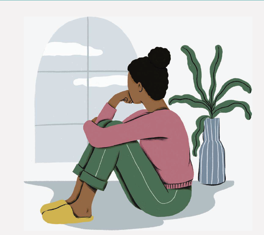 A girl sitting alone staring out the window.