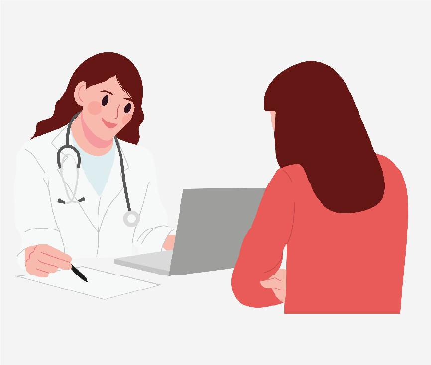 A doctor sitting in front of a laptop and patient with their back facing outward.