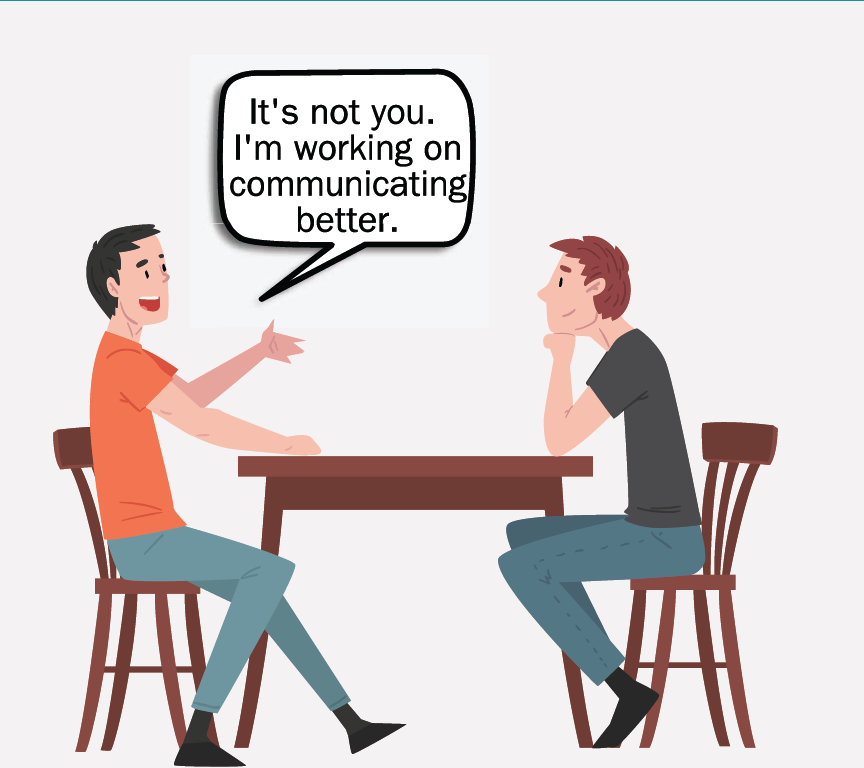 Two men sitting at a table. One man says, 