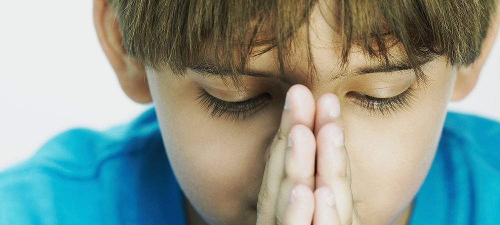 A Little Boy Praying