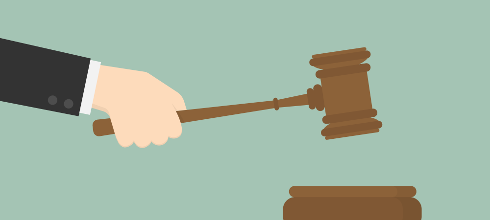 Cartoon rendering of a hand holding a gavel.