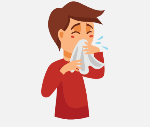 A sick boy covers his cough with a tissue.