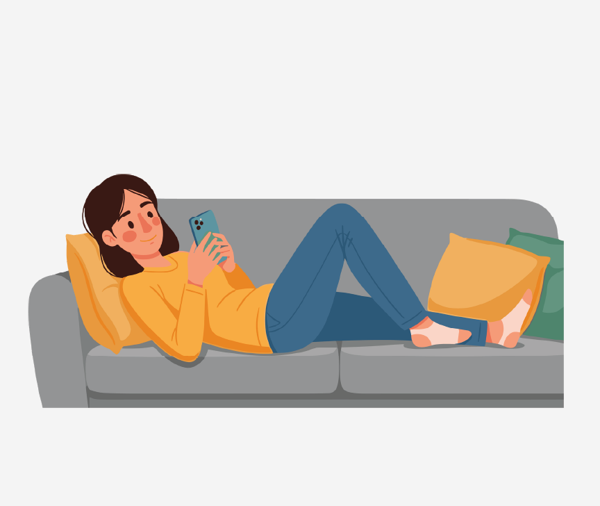 A woman lying on a coach playing on her cell phone.