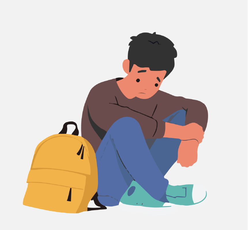 Sad-looking boy sitting on the ground with his backpack.