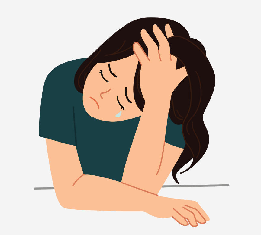 A crying girl with her head on her hand.