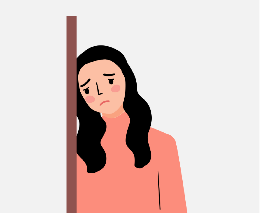 A sad girl leaning against the wall.