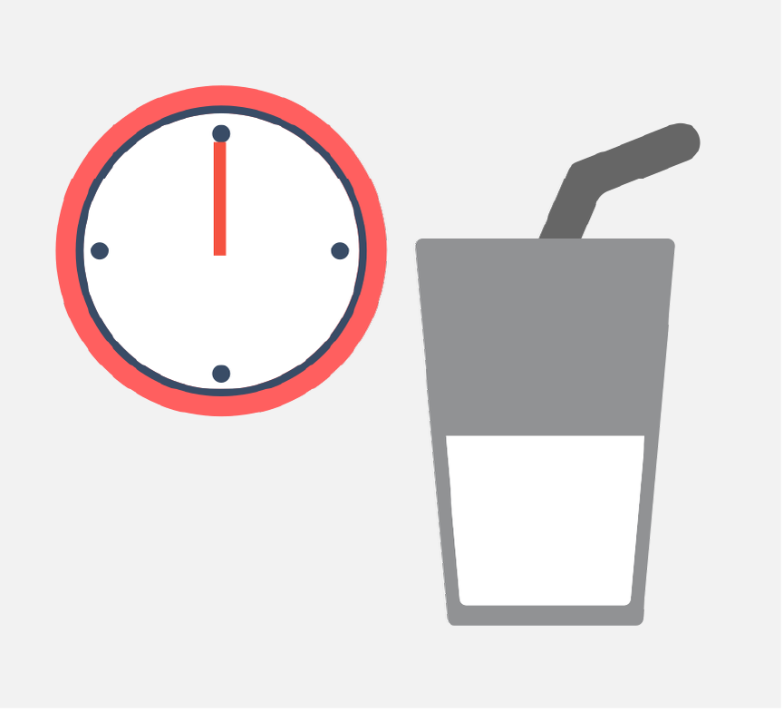 A red clock and a cup with a straw in it.