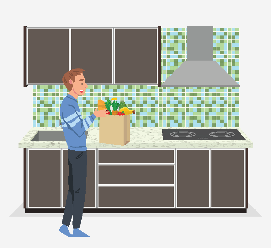 A man unpacking his groceries in a kitchen.
