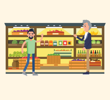 A man waves to a grocery store employee for help. The employee shows the man where what he's looking for is.