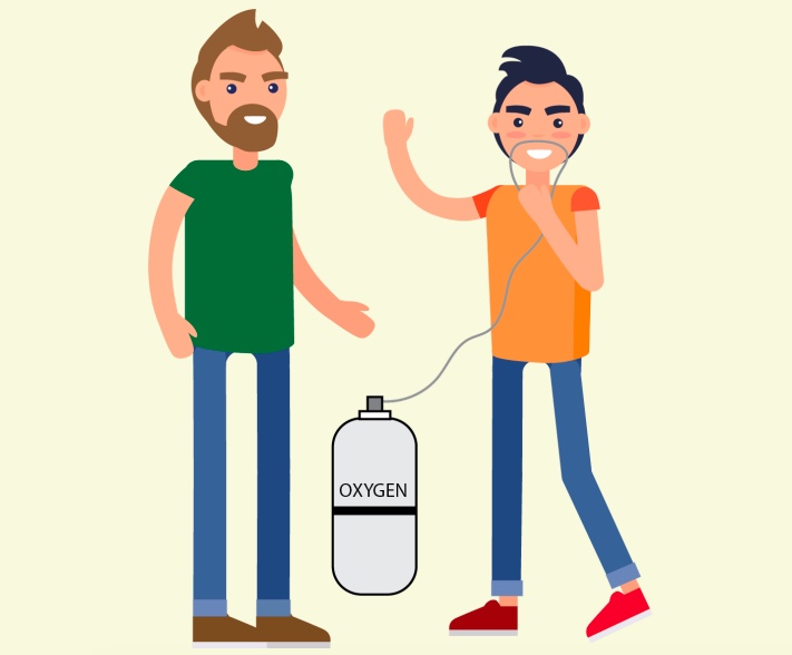 A man standing next to a boy with an oxygen tank.
