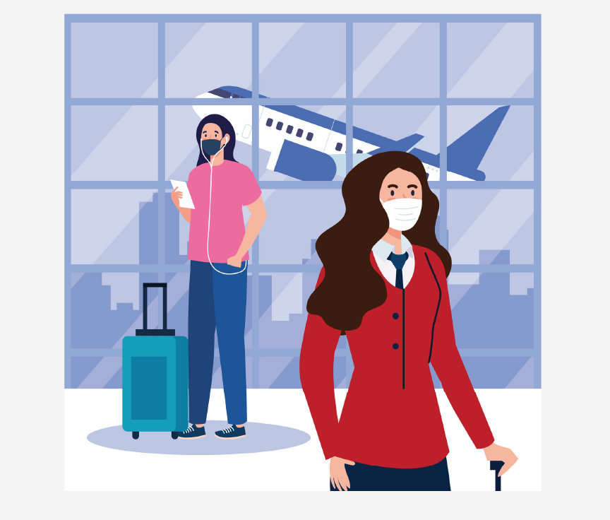 Two people wearing face masks in an airport