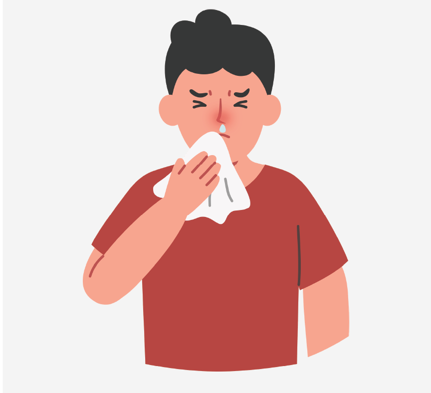 A boy blowing his nose.