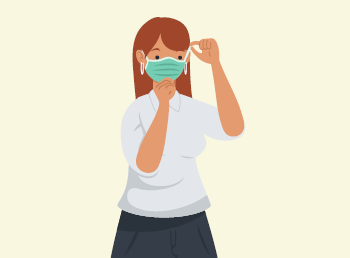 A woman putting on a face mask.