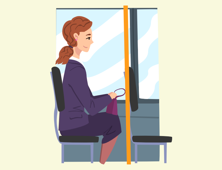 A woman sitting on a bus holding a purse.