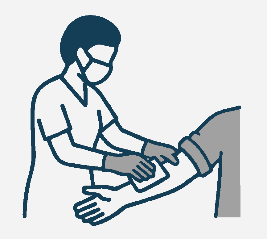 A nurse wearing a mask and cleaning a person's arm with an alcohol swab.